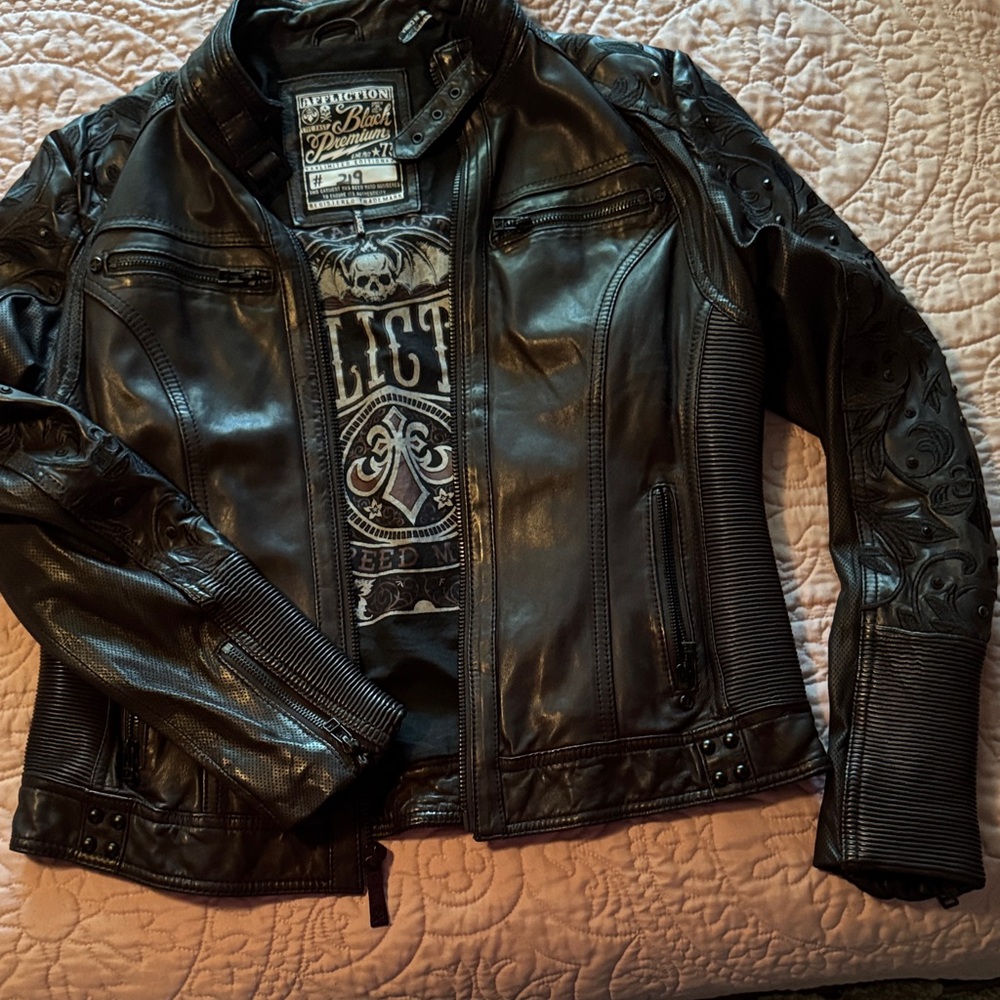 Numbered Affliction Black Leather Jacket with Embossed and Rhinestone Details.